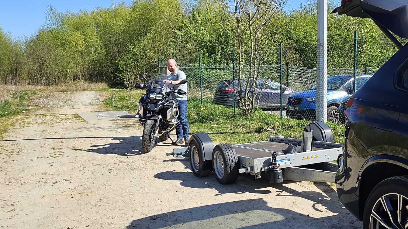 unloaded motorcycle behind a motorcycle trailer